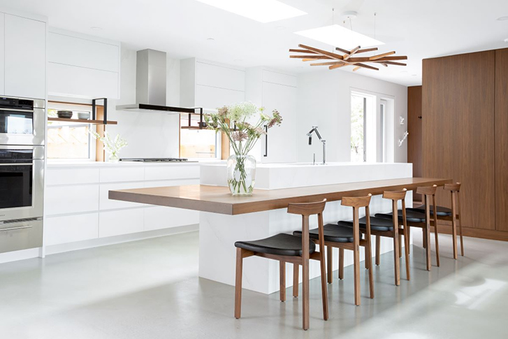 This winner features a white kitchen with wood accents