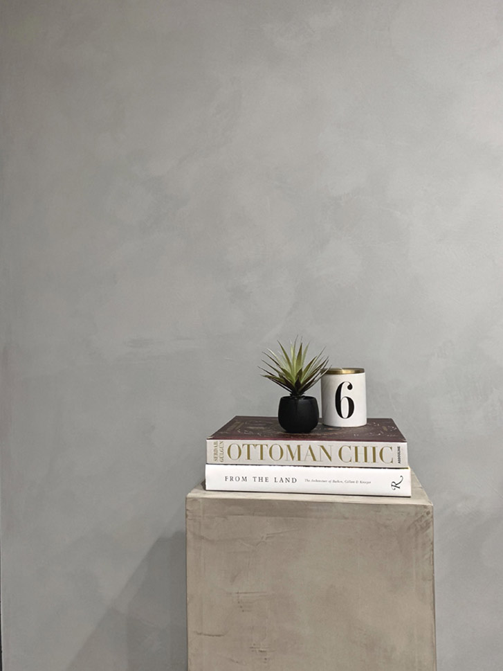 A wall and side table painted with limewash paint