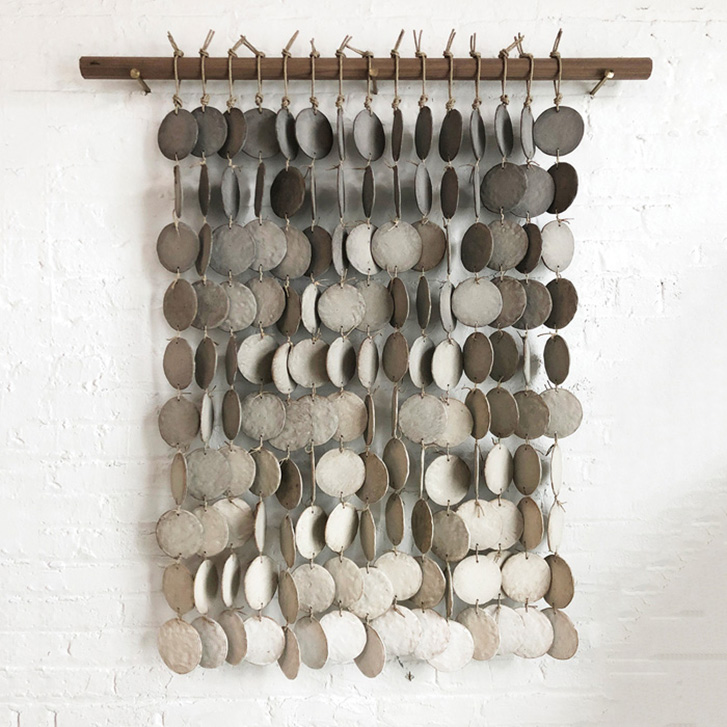 Wall hanging made of many ceramic discs