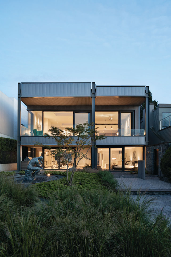 Measured Beach House Exterior Glass Walls at Sunset