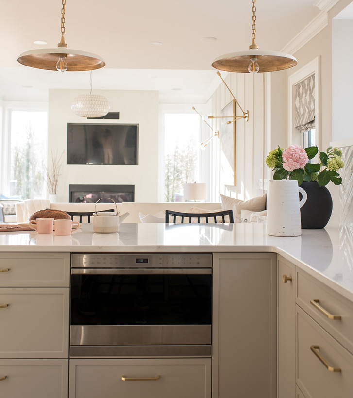 Kitchen showing island and brass lighting details