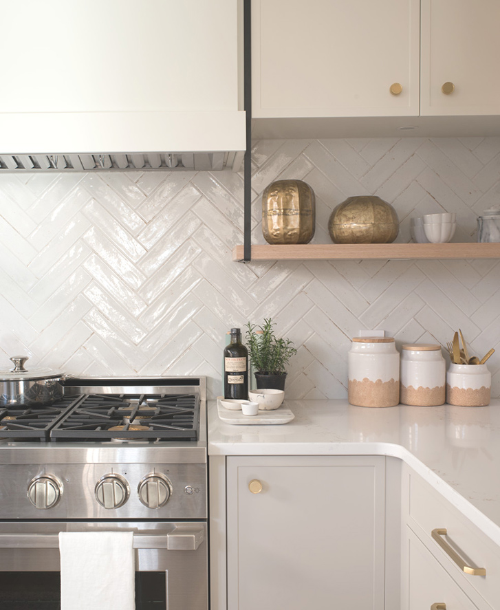 Kitchen showing herringbone tile and oven