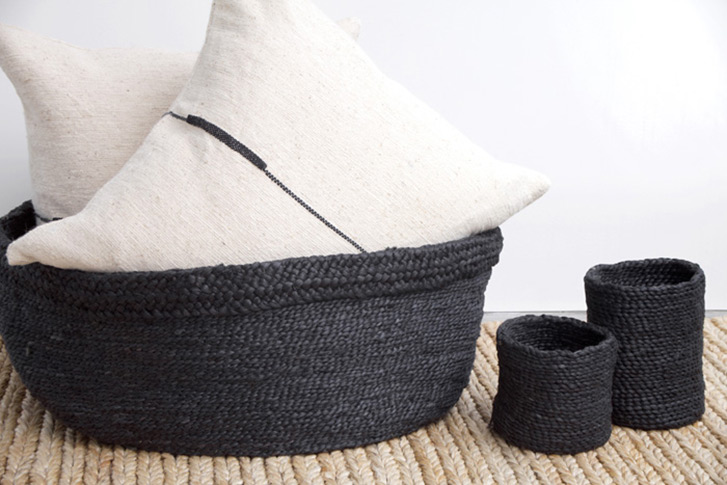 Black woven j'jute baskets and white pillows 