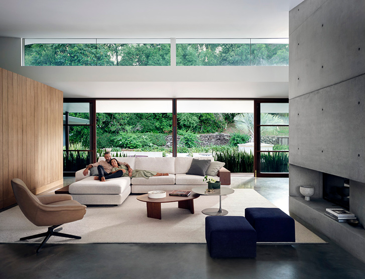 The Jasper sofa, which is a white chaise is shown in a modern home