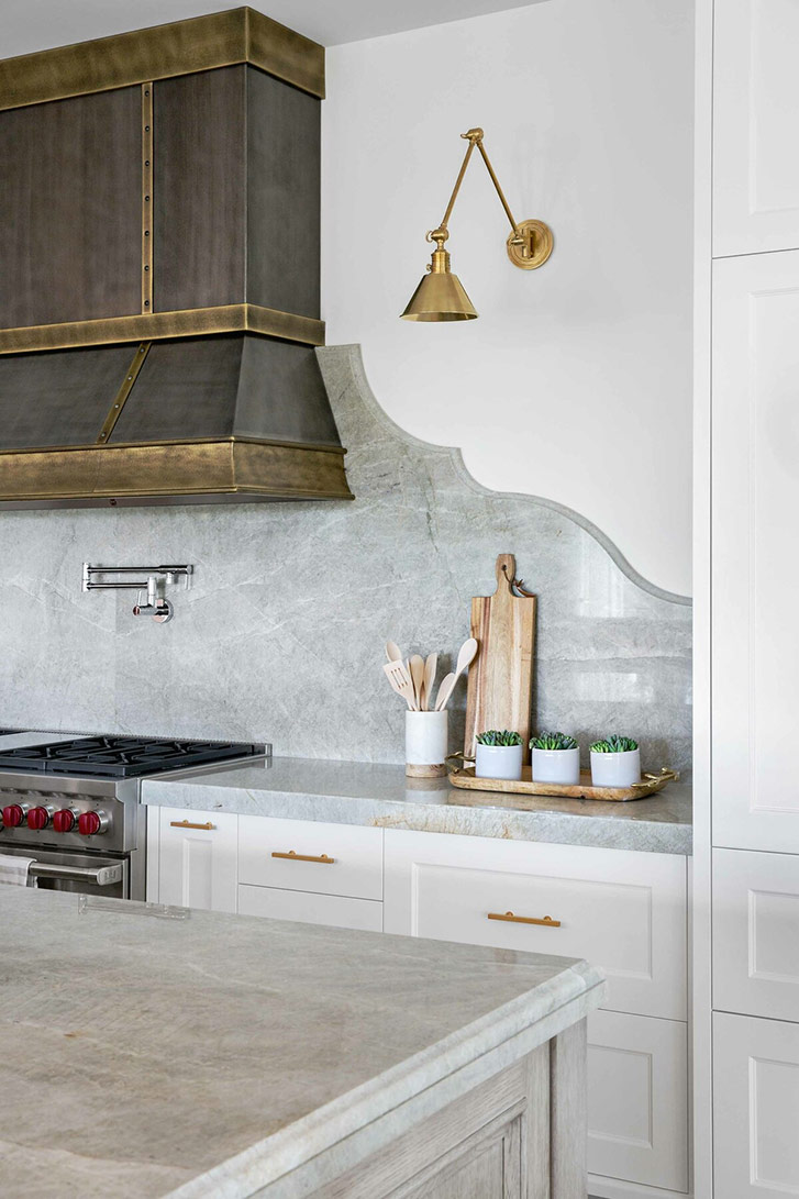 Gold light fixtures are the fixture of this kitchen