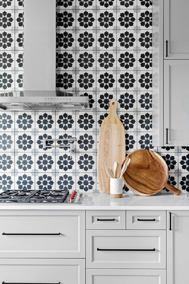 Close up on the blue decorative tile in this kitchen