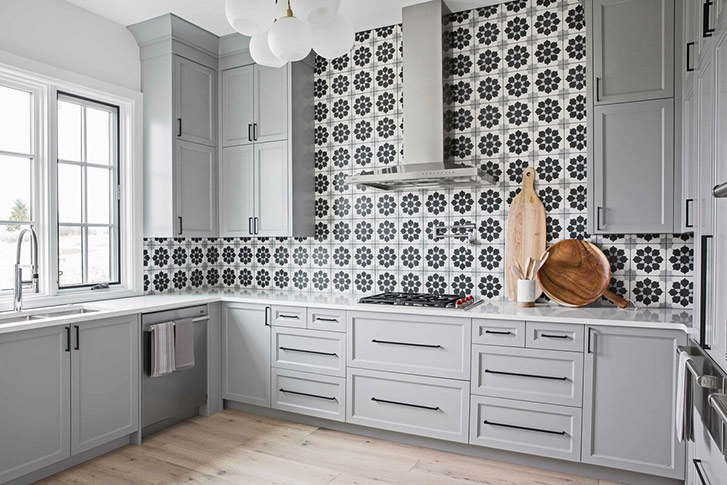 This kitchen is full of decorative tiles in shades of blue