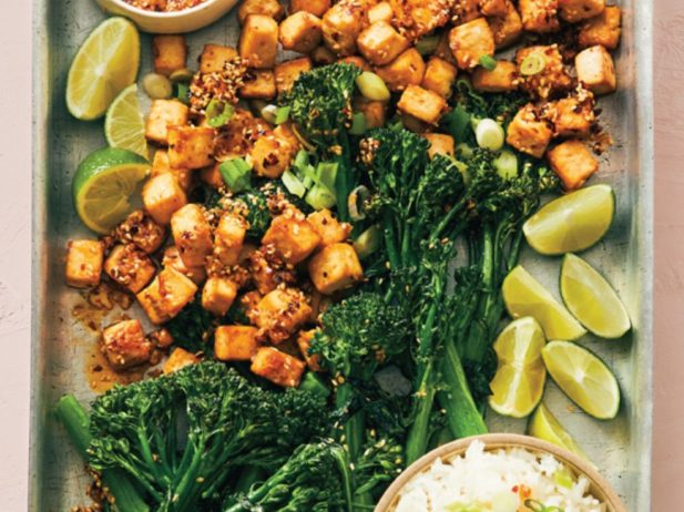 a bountiful platter of tofu, broccolini and lemon wedges