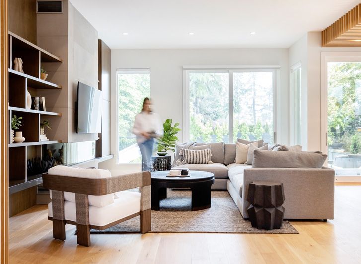 woman walking through living room in vancouver modern home
