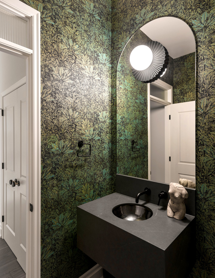 Bathroom with green jungle wallpaper