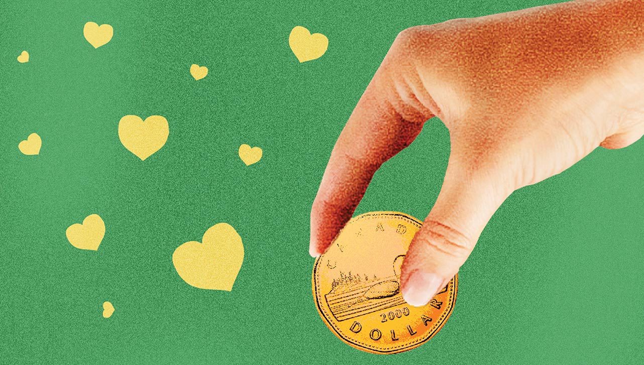 A hand holding a coin surrounded by hearts