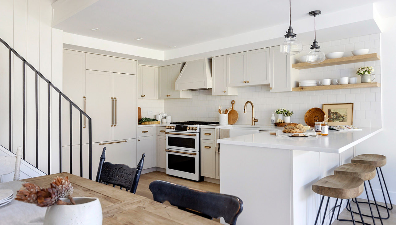 a kitchen in a whistler cabin with fresh white cabinets