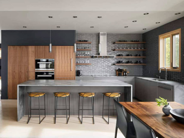 A modern design kitchen with grey walls and wood table