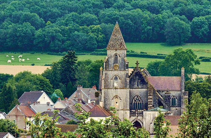 medieval church and roofs of houses in Champagne, France