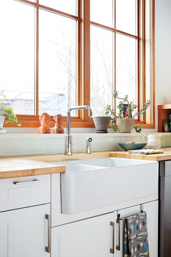 The farmhouse sink is slated for dish duty (a prep sink on the island handles cooking needs), so Simpson wanted it placed in front of the window.