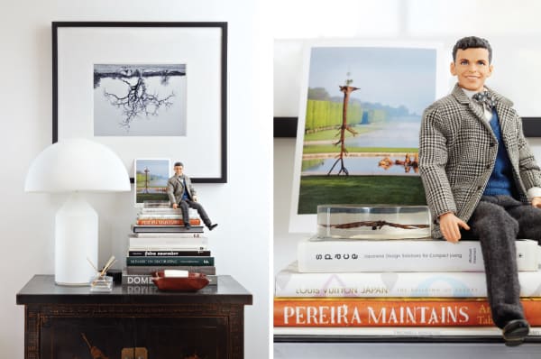 A Frank Sinatra doll keeps watch over a stack of Pereira's favourite design books.