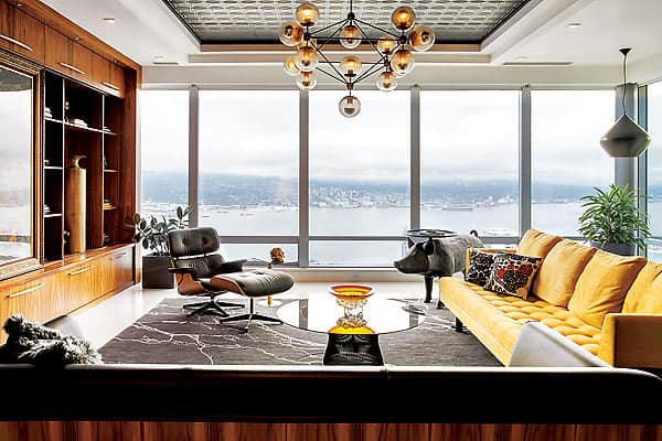 In this room with a view, yellow accent pieces lend a sunny disposition on cloudy days while basic black never gets boring.