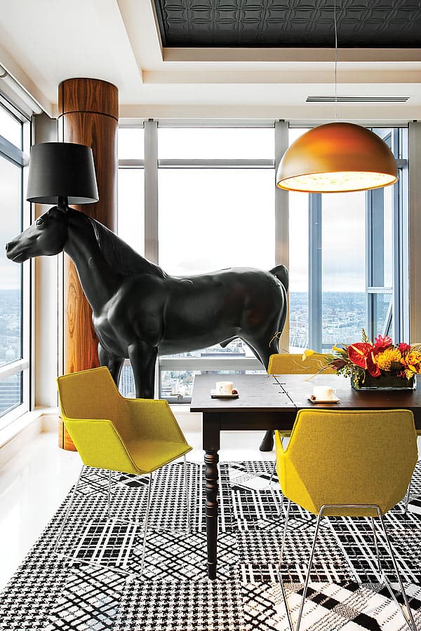 Moooi’s horse lamp anchors the dining room.