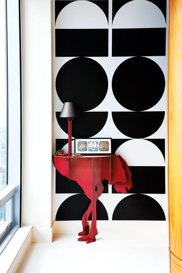 Rocker Lenny Kravitz’s Brasilia wallpaper for Flavor Design makes a graphic backdrop for the Diva Lucia Ostrich console table by Ibride.
