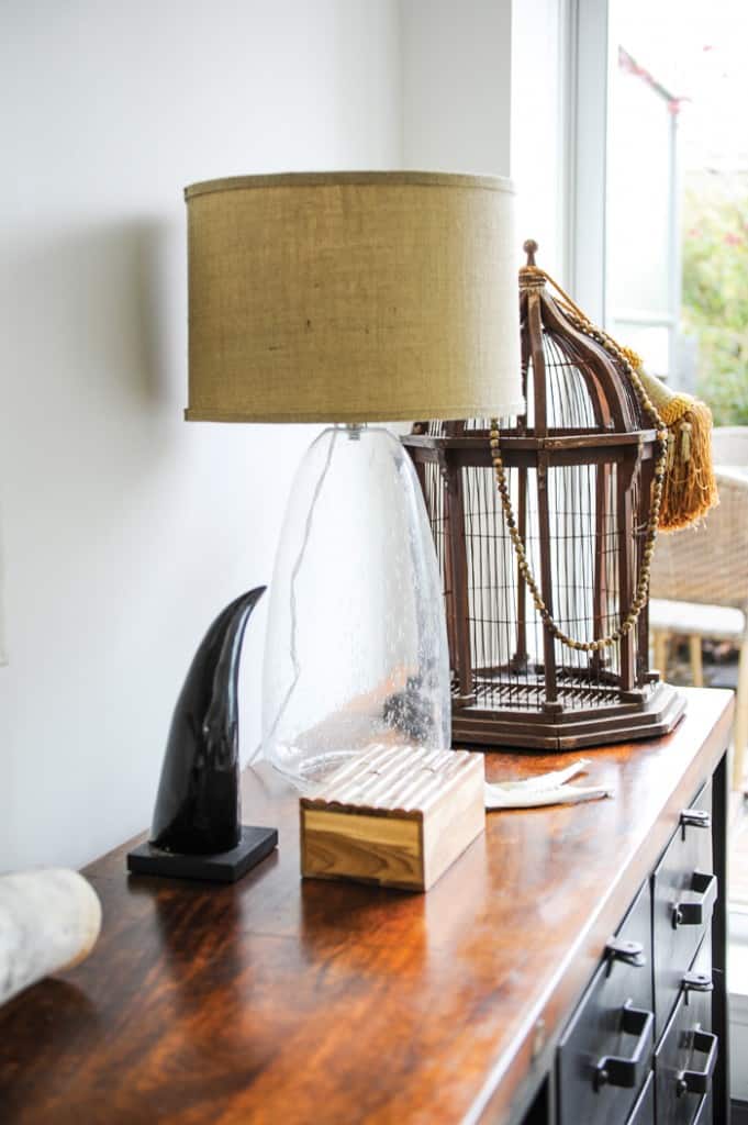 Oliver Simon tucked in more lady-like touches like this lamp made from natural materials like glass and linen.