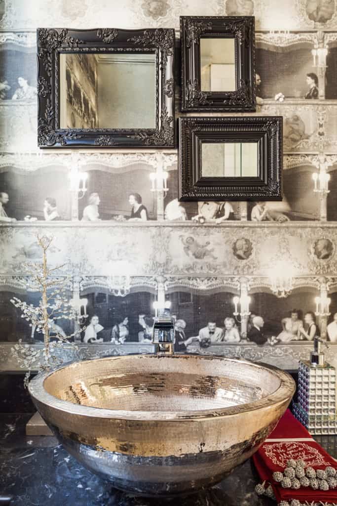 The main-floor powder room's wallpaper is actually a vintage print of the Viennese opera house.