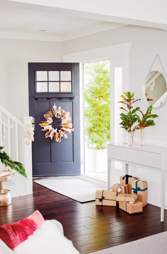 "I grew up on a farm," notes Falkenberg, "and we always had a tree outside with lights--it's  a welcoming thing for your guests." The Japanese cedar outside the door was sourced from Ryan Levy at Object Outdoors and Erica Enterprises.