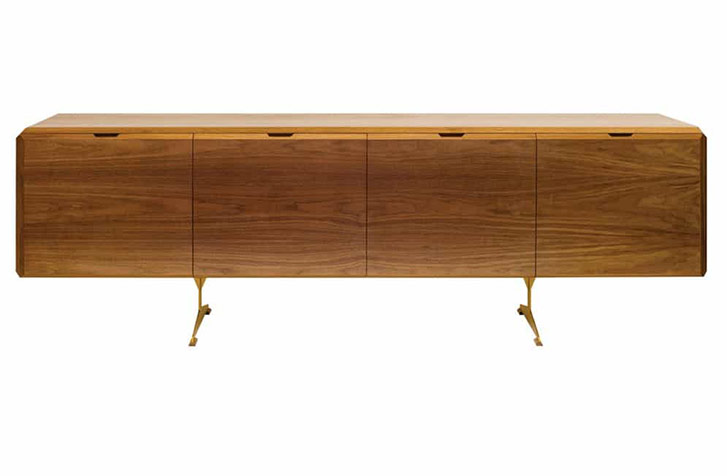 The credenza in Scruton’s Emerald Collection is a large piece—96 inches across—but doesn’t feel heavy, thanks to chamfered edges and the fine metal legs it rests on. It’s designed to tuck away household items—or a bar—without feeling like a filing cabinet or storage box. Photo by Mitchell Warner.
