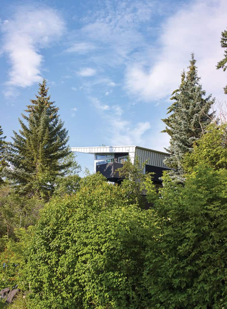 Despite its urban location in one of Calgary's inner-city neighbourhoods, the home feels private and surrounded by greenery, thanks to its position on a hill that slopes in two directions.