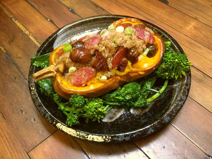 Chef Keev's holiday-ready dish is loaded with Chinese sausage—and served inside a butternut squash boat (Photo by Sai Woo). 