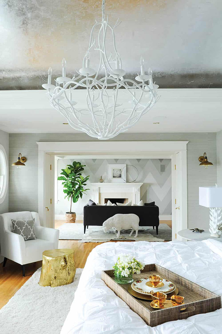 While the rest of this home is done up with bold colour, the bedroom was designed as a respite. But designer Ben Leavitt of Fox Design skipped the classic white-on-white in favour of richer neutrals: beige, grey, silver and gold. “We were trying to keep it wildly interesting, but as simple as possible,” laughs Leavitt. And interesting it is: above the bed, a curved ceiling is decked out in silver leading to reflect the light of the chandelier at night; in the connected reading room, a resin garden sculpture shaped like a sheep has been painted white and installed behind the sofa to be visible from the bed. “It plays on that idea of counting sheep,” Leavitt says. (Photo: Tracey Ayton.)