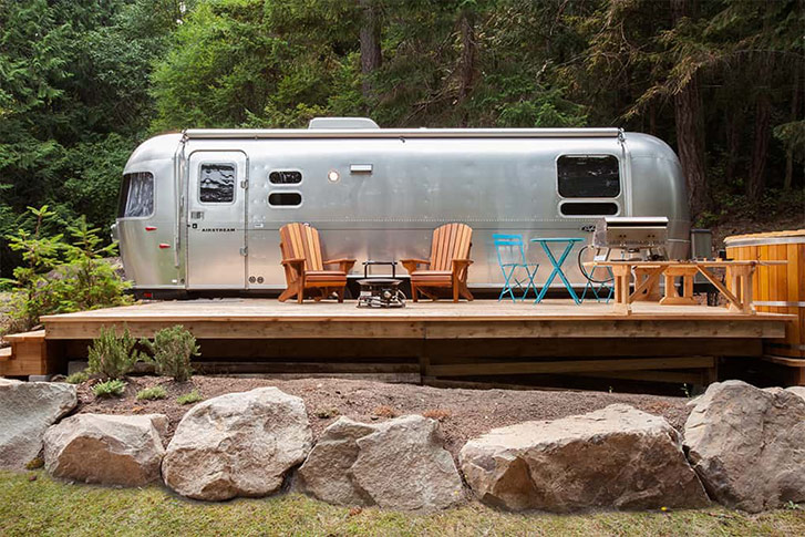 Each revamped Airstream has a propane-powered campfire to accompany of cabin-cool adirondack chairs, and a few even have hot tubs for two on the patio, too.