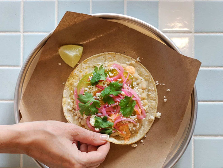 Tacos, tacos, tacos. Did we mention tacos? The menu, created in collaboration between Regional Chef Christine DeYoung and Co-Founders Jason Sussman and Kaeli Robinson introduces a number of new items to the Tacofino lineup, such as the White Bean Taco.