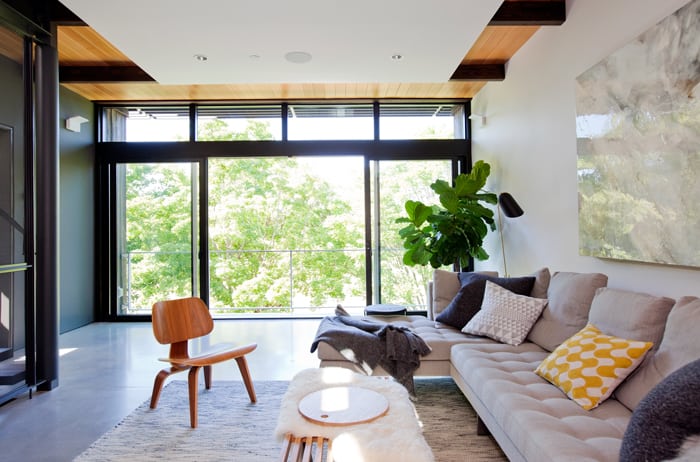 Outside the window are leafy trees from neighbouring Douglas Park. On warm days, folding glass doors in the living room push aside to transform the indoor space into yet another outdoor one.