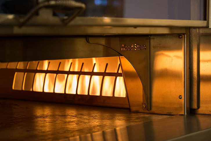 The wood burning stove is the centrepiece of the kitchen, turning out pizzas in just 6 minutes from the time you order.