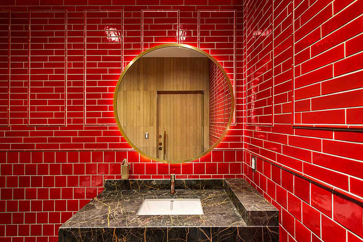 One of Bohn's favourite elements are the vintage red tiled bathrooms, designed to pay homage to the restaurant’s location in Vancouver's historic Chinatown.