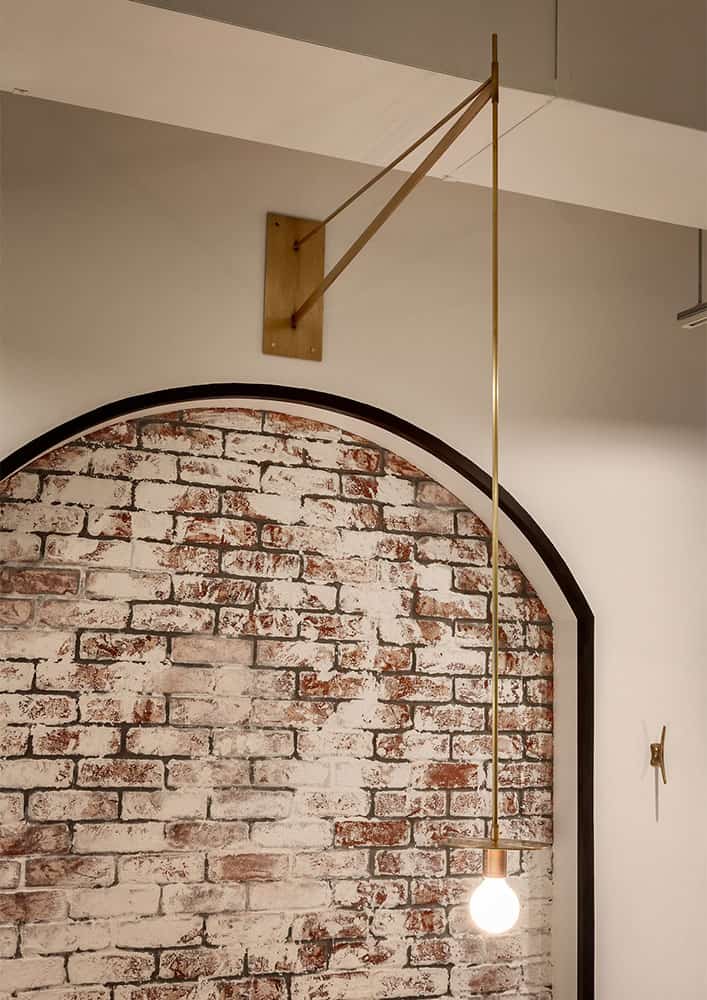 Bohn introduced modern details throughout the space, like these custom brass pendant lights.