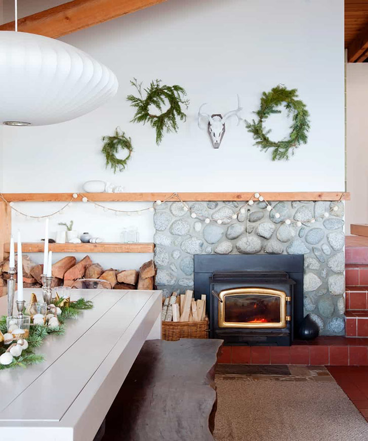 Homemade wreaths hang above the fire in designer Ami McKay's home. 