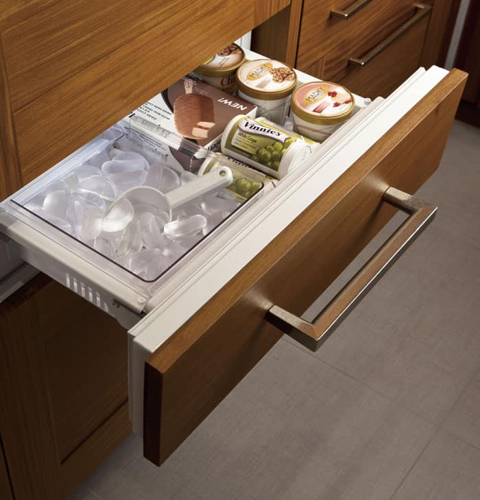 The ice maker is located in a drawer that's placed higher up than the typical pull-out freezer.