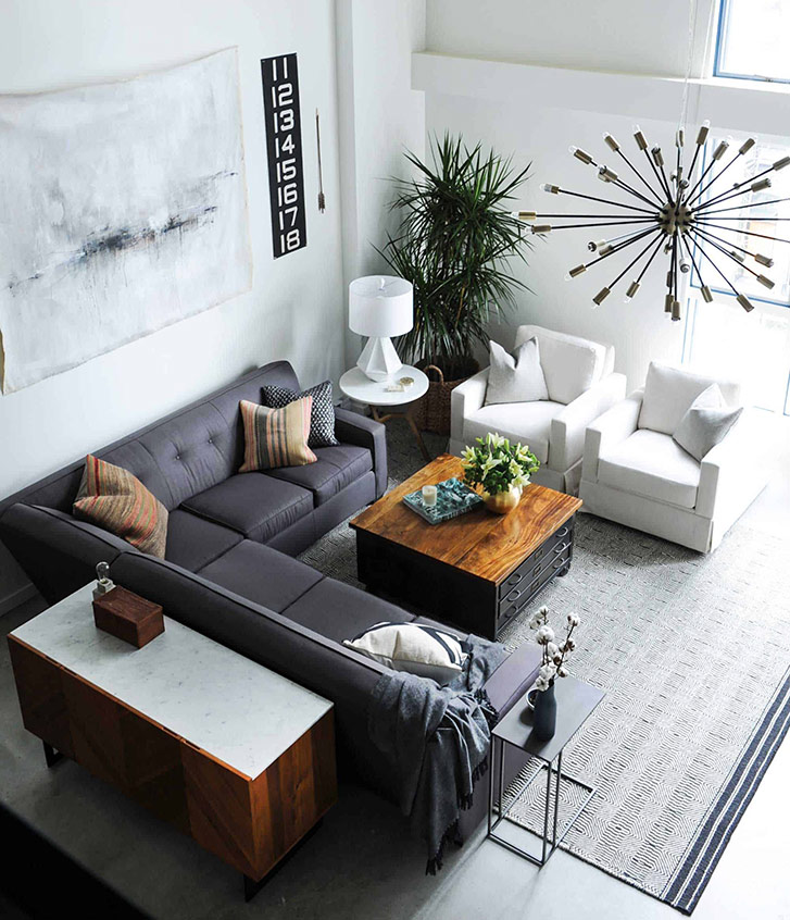industrial chic living room designed by Oliver Simon with L shaped sofa