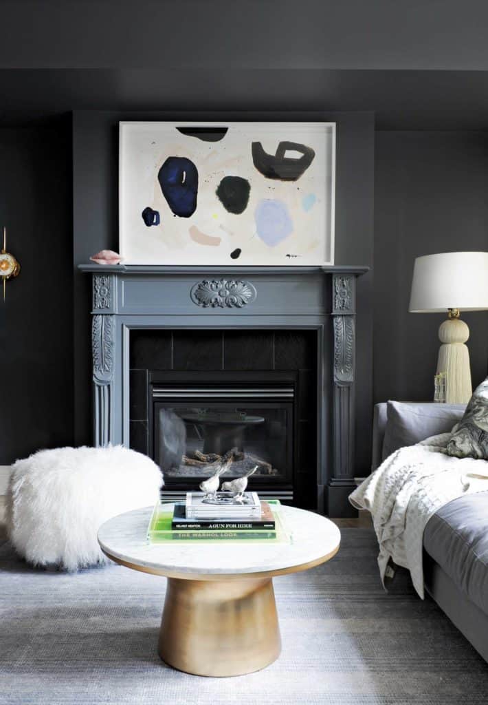 gillian segal designed living room with grey fireplace and rug